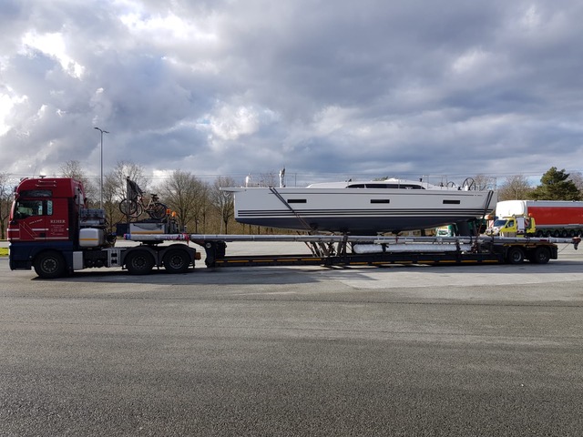 Boats are shipped by trucks